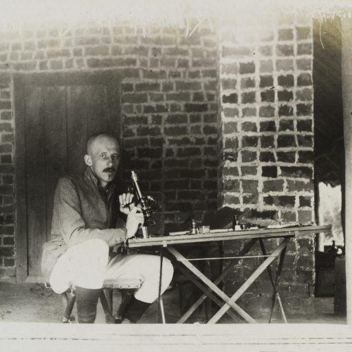 JL Todd with a microscope during an expedition to the Congo, ca. 1903
