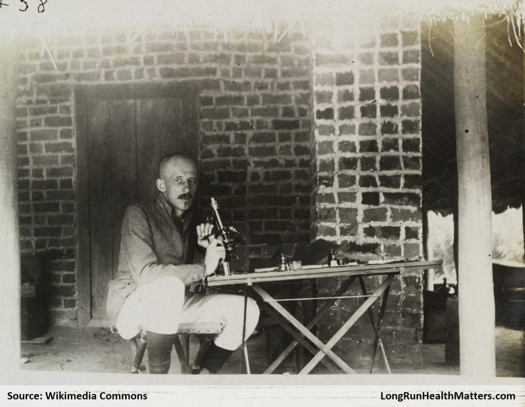 JL Todd with a microscope during an expedition to the Congo, ca. 1903